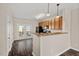 Open kitchen with granite countertops, breakfast bar, and access to deck at 235 Michigan Ave, Cary, NC 27519