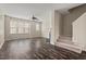 Open-concept living room with wood-look floors and abundant natural light at 235 Michigan Ave, Cary, NC 27519