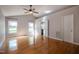 Spacious bedroom featuring hardwood floors, vaulted ceilings, and ample natural light at 2457 Millbrook Dr, Haw River, NC 27258