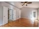 Spacious bedroom featuring hardwood floors, vaulted ceilings, and ensuite bathroom at 2457 Millbrook Dr, Haw River, NC 27258