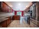Spacious kitchen featuring stainless steel appliances, granite counters, and a tiled floor at 2457 Millbrook Dr, Haw River, NC 27258