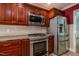 Modern kitchen featuring stainless steel appliances, granite counters, and ample storage space at 2457 Millbrook Dr, Haw River, NC 27258