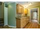 Kitchen featuring wooden cabinets and a double sink at 2457 Millbrook Dr, Haw River, NC 27258