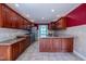 Well-appointed kitchen boasts granite countertops, stainless steel appliances, and ample cabinetry at 2457 Millbrook Dr, Haw River, NC 27258