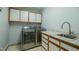 Laundry room with washer, dryer, and storage cabinets at 2457 Millbrook Dr, Haw River, NC 27258