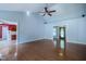 Inviting living room features hardwood floors, ceiling fan and ample natural light at 2457 Millbrook Dr, Haw River, NC 27258