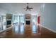 Spacious living room boasts hardwood floors, a fireplace, and bright windows at 2457 Millbrook Dr, Haw River, NC 27258