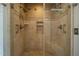 This walk-in shower features body sprayers, tile surround, a bench, and a shower niche at 2457 Millbrook Dr, Haw River, NC 27258