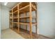 Spacious storage area featuring sturdy wooden shelving units for ample organizational options at 2457 Millbrook Dr, Haw River, NC 27258