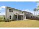 Backyard view showcasing a screened porch and outdoor patio at 2650 Turner Pines Dr, New Hill, NC 27562