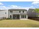 Backyard view showcasing a screened porch and outdoor patio at 2650 Turner Pines Dr, New Hill, NC 27562