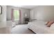 Comfortable bedroom with carpet, natural light and a bookshelf next to a twin bed at 2650 Turner Pines Dr, New Hill, NC 27562