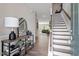 Inviting foyer with hardwood floors, staircase, and stylish decor at 2650 Turner Pines Dr, New Hill, NC 27562