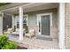 Charming covered front porch featuring brick accents and stylish seating, perfect for relaxing at 2650 Turner Pines Dr, New Hill, NC 27562