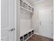 Mudroom entrance with storage bench and cubbies, offers convenience and organization at 2650 Turner Pines Dr, New Hill, NC 27562