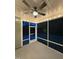 Cozy screened-in porch with ceiling fan, outdoor lighting, and exterior views at 2650 Turner Pines Dr, New Hill, NC 27562