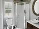This bathroom features a glass shower, modern sink, and decorative mirror at 280 Dreamcatcher Trl, Youngsville, NC 27596