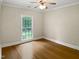 Empty bedroom featuring neutral paint, hardwood flooring, and a ceiling fan at 280 Dreamcatcher Trl, Youngsville, NC 27596