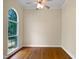 Empty bedroom with hardwood floors, natural light, and crown molding at 280 Dreamcatcher Trl, Youngsville, NC 27596