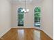 Bright dining room with hardwood floors, crown molding, and large windows at 280 Dreamcatcher Trl, Youngsville, NC 27596
