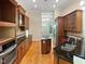Modern kitchen with stainless steel appliances, granite countertops and custom cabinets at 280 Dreamcatcher Trl, Youngsville, NC 27596