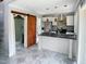 This kitchen features white cabinets, a marble island, and stainless steel appliances at 280 Dreamcatcher Trl, Youngsville, NC 27596