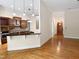 Open-concept kitchen with granite countertops and custom cabinetry at 280 Dreamcatcher Trl, Youngsville, NC 27596