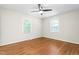 Bedroom with hardwood floors, ceiling fan and two windows with natural light at 2917 Trail Six, Burlington, NC 27215