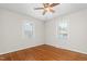 Bedroom featuring hardwood floors, a ceiling fan and two windows with natural light at 2917 Trail Six, Burlington, NC 27215