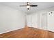 Bright bedroom with hardwood floors, a ceiling fan, and plenty of closet space at 2917 Trail Six, Burlington, NC 27215