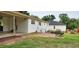 Exterior showcasing a brick patio, carport, and expansive green backyard at 2917 Trail Six, Burlington, NC 27215