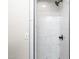 Modern tiled walk in shower stall with matte black fixtures and bright lighting at 2917 Trail Six, Burlington, NC 27215