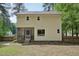 Yellow two-story home featuring a screened-in porch and landscaped yard at 300 Hutchins Dr, Garner, NC 27529