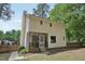 A charming two-story yellow home with a cozy screened-in porch at 300 Hutchins Dr, Garner, NC 27529