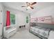 A bedroom features a bunk bed, toy bench, and a window for natural light, designed for children at 300 Hutchins Dr, Garner, NC 27529
