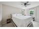 Spacious main bedroom featuring neutral tones, ceiling fan and large windows for great natural light at 300 Hutchins Dr, Garner, NC 27529