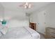 A cozy bedroom with a white ceiling fan and a view of another door leading to a different room at 300 Hutchins Dr, Garner, NC 27529