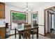 Cozy dining area with backyard view, adjacent to the kitchen at 300 Hutchins Dr, Garner, NC 27529