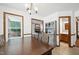 Dining room with a view of the living room and access to the bathroom at 300 Hutchins Dr, Garner, NC 27529
