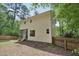 Exterior of home featuring a screened porch and wooded lot at 300 Hutchins Dr, Garner, NC 27529