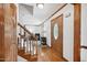 Welcoming foyer with hardwood floors and a staircase leading to the upper level at 300 Hutchins Dr, Garner, NC 27529