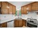 Well-maintained kitchen with stainless steel appliances and wood cabinetry at 300 Hutchins Dr, Garner, NC 27529