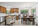 Eat-in kitchen area with stainless steel appliances and access to backyard view at 300 Hutchins Dr, Garner, NC 27529