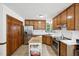 Traditional kitchen features stainless steel appliances, wooden cabinetry, and a kitchen island at 300 Hutchins Dr, Garner, NC 27529