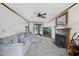 Inviting living room with fireplace, large sectional couch, and French doors to the backyard at 300 Hutchins Dr, Garner, NC 27529