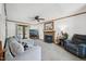 Cozy living room with a fireplace, comfortable seating, and plenty of natural light at 300 Hutchins Dr, Garner, NC 27529