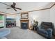 Comfortable living room features a fireplace, entertainment center, and cozy seating area at 300 Hutchins Dr, Garner, NC 27529