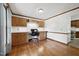 Spacious office with wood floors and built-in cabinets and desk, perfect for working from home at 300 Hutchins Dr, Garner, NC 27529