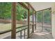 Screened porch featuring wood floors and view of fenced yard at 300 Hutchins Dr, Garner, NC 27529