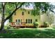 The backyard features a well maintained lawn, mature trees, and a wooden deck at 300 Silvercliff Trl, Cary, NC 27513